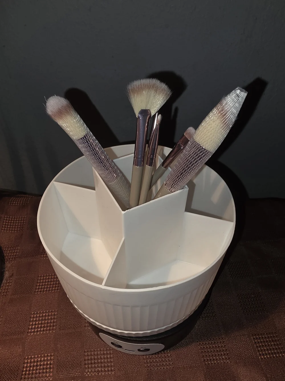 Cream Rotating Makeup Brush Organizer with 6 Brushes.